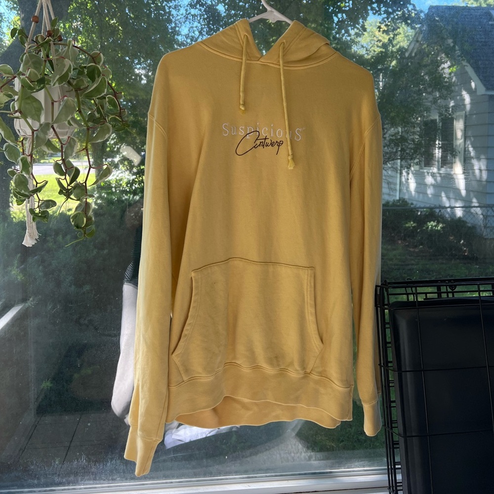 Suspicious Antwerp yellow hoodie - size large. Small stain shown in picture